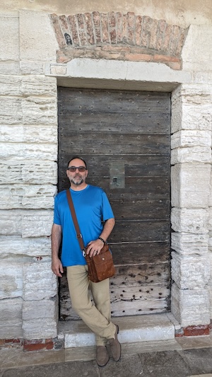 Photo of Tony standing in a doorway